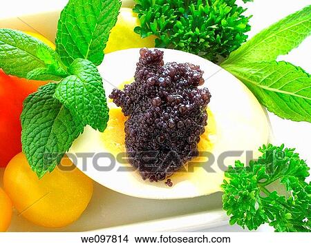 Picture - Boiled egg, Lumpfish roe, tomatoes and mint. Fotosearch