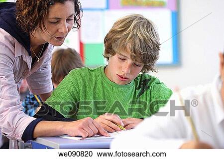 Stock Image - book, boy, child, classroom. Fotosearch