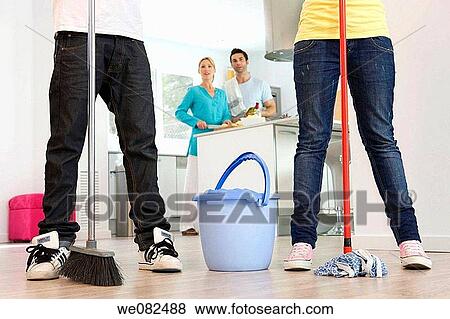 Stock Photo - boy, brother, broom, at-home. Fotosearch