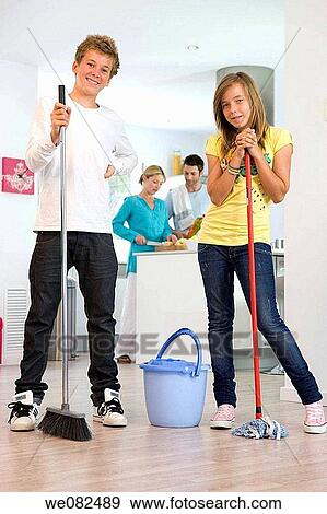 boy, brother, broom, at-home View Large Photo Image Stock Photo - boy, brother, broom, at-home. Fotosearch
