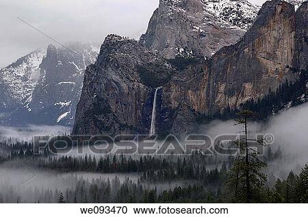 Bridalveil Fall emptying into clouds and fog in Yosemite Valley after a winter storm seen from Tunnel View View Large Photo Image Stock Image - Bridalveil Fall emptying into clouds and fog in Yosemite Valley after a winter storm seen from Tunnel View. Fotosearch