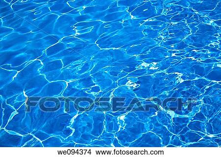 Bright blue swimming pool water as a background View Large Photo Image Picture - Bright blue swimming pool water as a background. Fotosearch