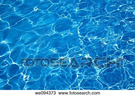 Bright blue swimming pool water as a background View Large Photo Image Stock Image - Bright blue swimming pool water as a background. Fotosearch