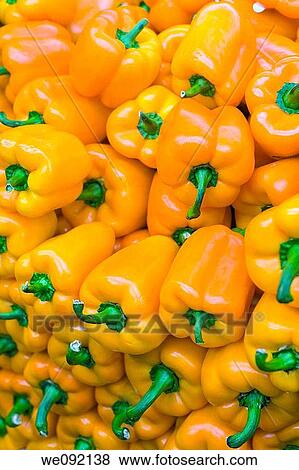 Bright yellow peppers piled up View Large Photo Image Stock Photo - Bright yellow peppers piled up. Fotosearch