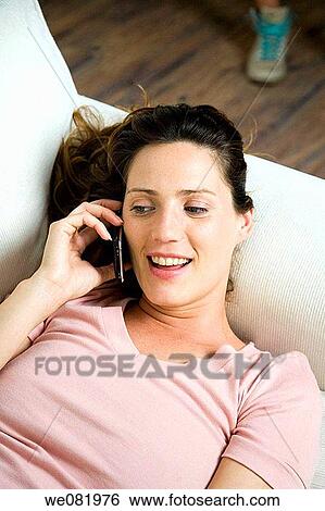 brown hair, cell phone, calling, at-home View Large Photo Image Stock Photograph - brown hair, cell phone, calling, at-home. Fotosearch