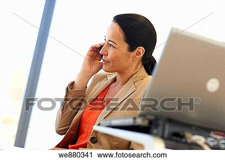 Stock Image - brunette, business, businesspeople, businesswoman, calling. Fotosearch