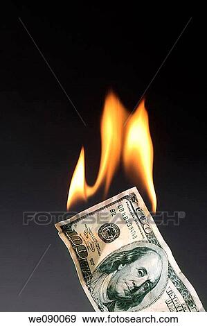 Stock Photo - Burning money. Fotosearch