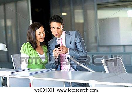 Stock Image - business, businessman, businesspeople, cell phone. Fotosearch
