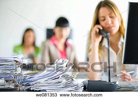 Stock Image - business, businesspeople, businesswoman, calling. Fotosearch