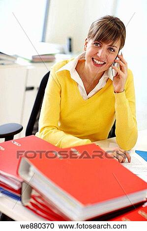 Stock Image - business, businesspeople, businesswoman, calling. Fotosearch