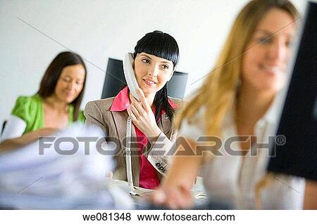 Stock Photo - business, businesspeople, businesswoman, calling. Fotosearch