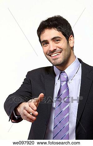 Stock Image - Business man offering handshake on white background. Fotosearch