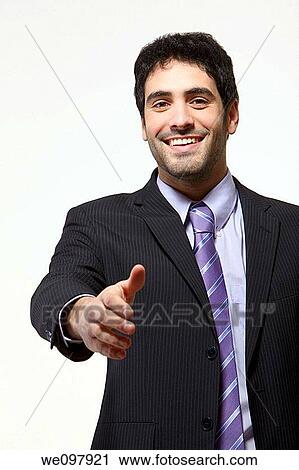 Stock Image - Business man offering handshake on white background. Fotosearch