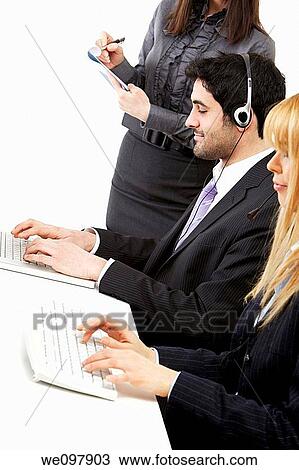 Business people working on a call centre office View Large Photo Image Stock Image - Business people working on a call centre office. Fotosearch