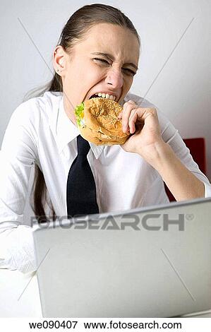 Business Woman Eating Sandwich and Working View Large Photo Image Stock Photo - Business Woman Eating Sandwich and Working. Fotosearch