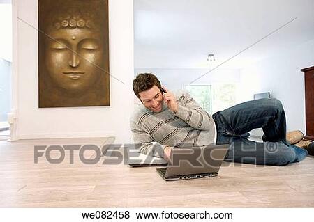 Stock Photo - calling, chat, cell phone, at-home. Fotosearch