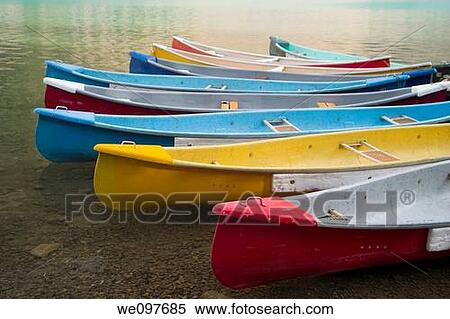 canoes parked at moraine lakeshore View Large Photo Image Stock Photography - canoes parked at moraine lakeshore. Fotosearch
