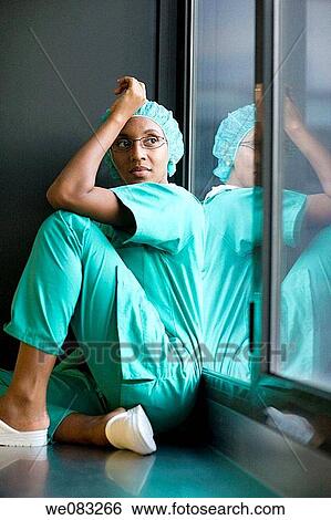 Stock Photograph - cap, doctor, day, absorbed. Fotosearch