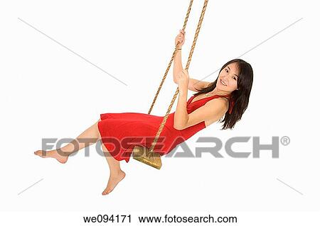 Caucasian Asian woman in wooden swing on white background View Large Photo Image Stock Image - Caucasian Asian woman in wooden swing on white background. Fotosearch
