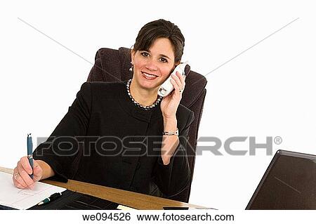 Caucasian businesswoman setting a desk and smiling View Large Photo Image Stock Photograph - Caucasian businesswoman setting a desk and smiling. Fotosearch