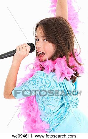 Caucasian children singing karaoke on a white background View Large Photo Image Stock Image - Caucasian children singing karaoke on a white background. Fotosearch