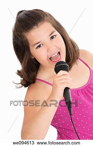 Caucasian children singing karaoke on a white background View Large Photo Image Stock Image - Caucasian children singing karaoke on a white background. Fotosearch