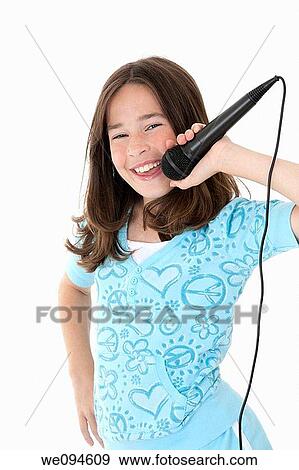 Caucasian children singing karaoke on a white background View Large Photo Image Stock Photo - Caucasian children singing karaoke on a white background. Fotosearch