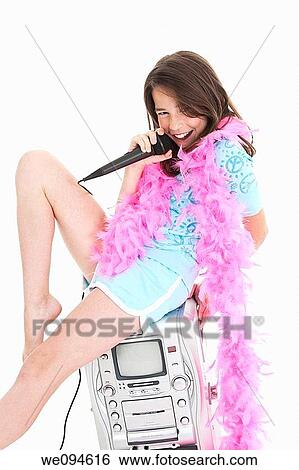 Caucasian children singing karaoke on a white background View Large Photo Image Stock Photograph - Caucasian children singing karaoke on a white background. Fotosearch