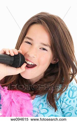 Caucasian children singing karaoke on a white background View Large Photo Image Stock Photography - Caucasian children singing karaoke on a white background. Fotosearch