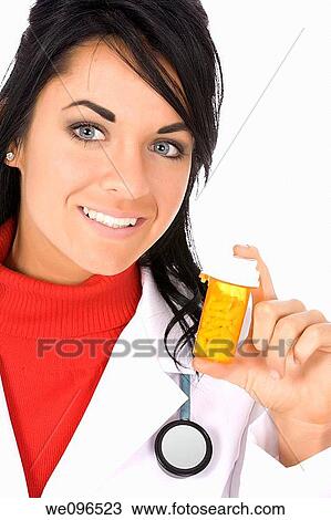 Caucasian doctor holding a bottle of pills View Large Photo Image Stock Image - Caucasian doctor holding a bottle of pills. Fotosearch