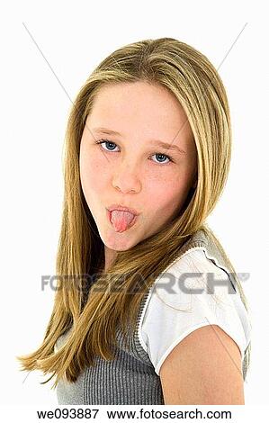 Caucasian preteen girl displaying some attitude by sticking out her tongue View Large Photo Image Stock Photo - Caucasian preteen girl displaying some attitude by sticking out her tongue. Fotosearch