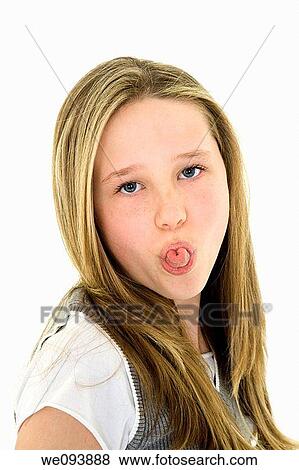 Caucasian preteen girl displaying some attitude by sticking out her tongue View Large Photo Image Stock Photo - Caucasian preteen girl displaying some attitude by sticking out her tongue. Fotosearch
