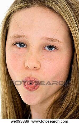 Caucasian preteen girl displaying some attitude by sticking out her tongue View Large Photo Image Stock Photo - Caucasian preteen girl displaying some attitude by sticking out her tongue. Fotosearch