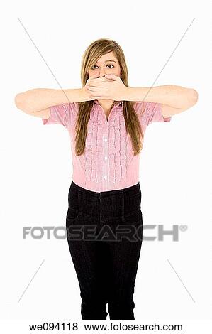 Caucasian teenager displaying some attitude with the Speak No Evil hands over mouth View Large Photo Image Stock Photo - Caucasian teenager displaying some attitude with the Speak No Evil hands over mouth. Fotosearch