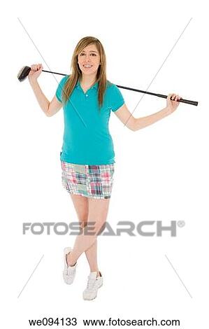 Stock Image - Caucasian teenager posing with golf club on white background. Fotosearch