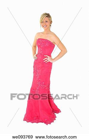 Caucasian teenager wearing a prom bress standing on a white background View Large Photo Image Stock Photo - Caucasian teenager wearing a prom bress standing on a white background. Fotosearch
