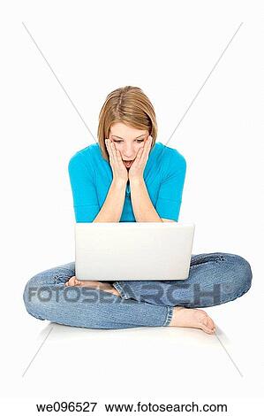 Caucasian teenager working on a laptop computer View Large Photo Image Stock Photo - Caucasian teenager working on a laptop computer. Fotosearch