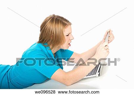 Caucasian teenager working on a laptop computer View Large Photo Image Stock Photo - Caucasian teenager working on a laptop computer. Fotosearch