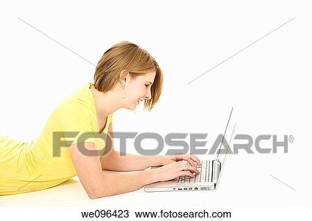 Caucasian teenager working on laptop computer View Large Photo Image Stock Image - Caucasian teenager working on laptop computer. Fotosearch