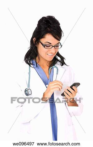 Caucasian woman doctor entering data into a pda on white background View Large Photo Image Stock Photo - Caucasian woman doctor entering data into a pda on white background. Fotosearch
