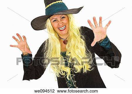 Caucasian woman dressed as a scary witch standing on white background View Large Photo Image Stock Image - Caucasian woman dressed as a scary witch standing on white background. Fotosearch
