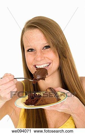 Caucasian woman eating slice of chocolate cake View Large Photo Image Stock Image - Caucasian woman eating slice of chocolate cake. Fotosearch