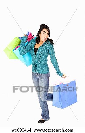 Caucasian woman holding shopping bags on white background View Large Photo Image Picture - Caucasian woman holding shopping bags on white background. Fotosearch