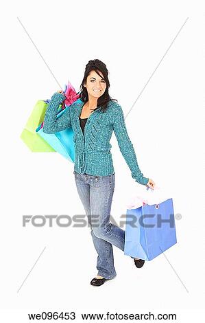 Caucasian woman holding shopping bags on white background View Large Photo Image Stock Image - Caucasian woman holding shopping bags on white background. Fotosearch