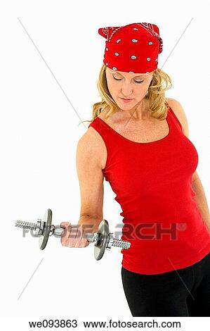 Caucasian woman in early 40s lifting weights using a dumbbell on a white background View Large Photo Image Stock Image - Caucasian woman in early 40s lifting weights using a dumbbell on a white background. Fotosearch