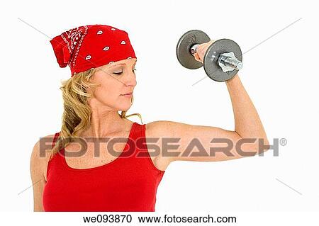 Caucasian woman in early 40s lifting weights using a dumbbell on a white background View Large Photo Image Stock Image - Caucasian woman in early 40s lifting weights using a dumbbell on a white background. Fotosearch
