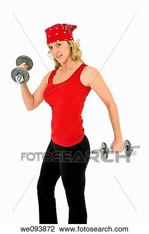 Caucasian woman in early 40s lifting weights using a dumbbell on a white background View Large Photo Image Stock Image - Caucasian woman in early 40s lifting weights using a dumbbell on a white background. Fotosearch