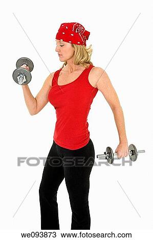 Caucasian woman in early 40s lifting weights using a dumbbell on a white background View Large Photo Image Stock Image - Caucasian woman in early 40s lifting weights using a dumbbell on a white background. Fotosearch