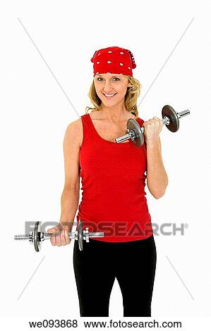 Caucasian woman in early 40s lifting weights using a dumbbell on a white background View Large Photo Image Stock Photo - Caucasian woman in early 40s lifting weights using a dumbbell on a white background. Fotosearch