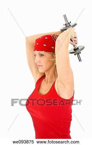 Caucasian woman in early 40s lifting weights using a dumbbell on a white background View Large Photo Image Stock Photography - Caucasian woman in early 40s lifting weights using a dumbbell on a white background. Fotosearch